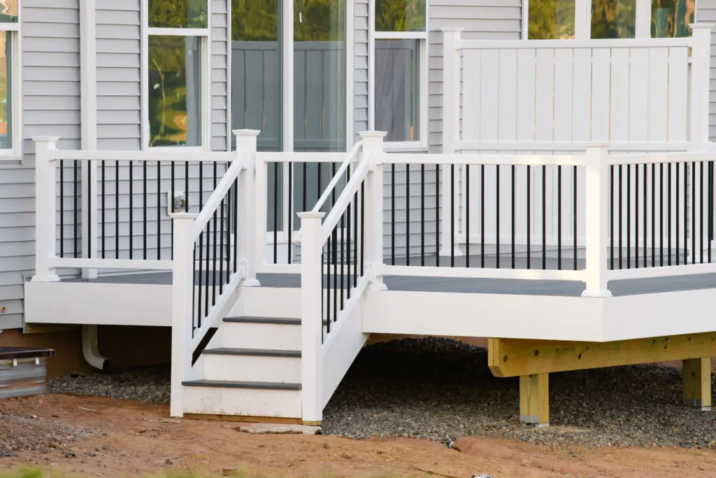 A white deck with black railings