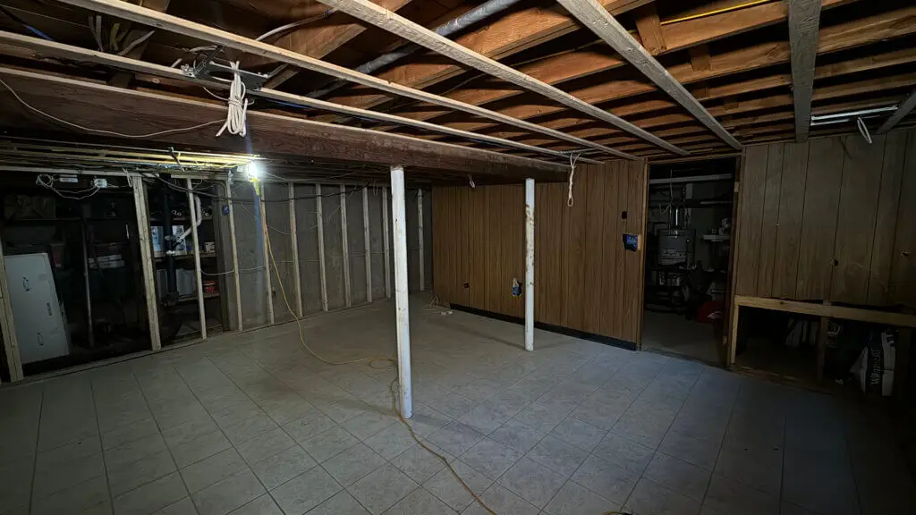 A room with wood beams and a wood ceiling
