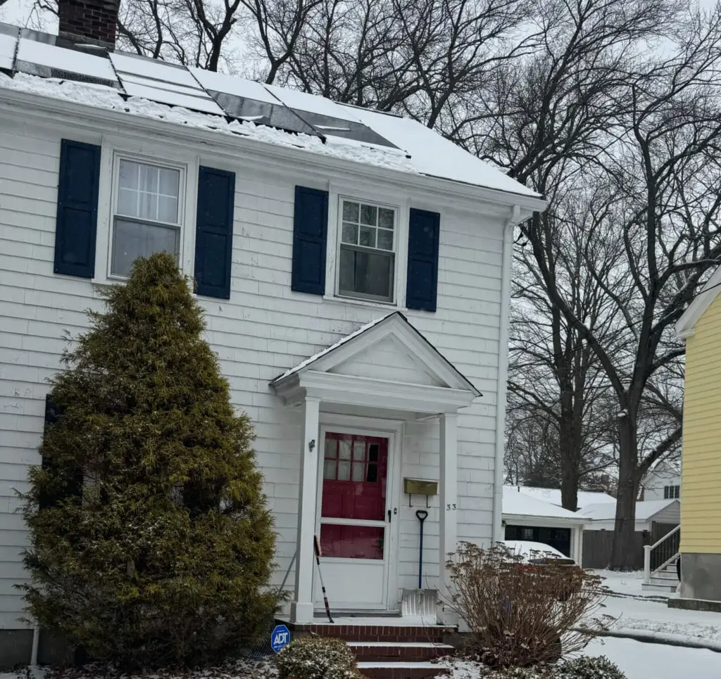 A house with snow on the roof