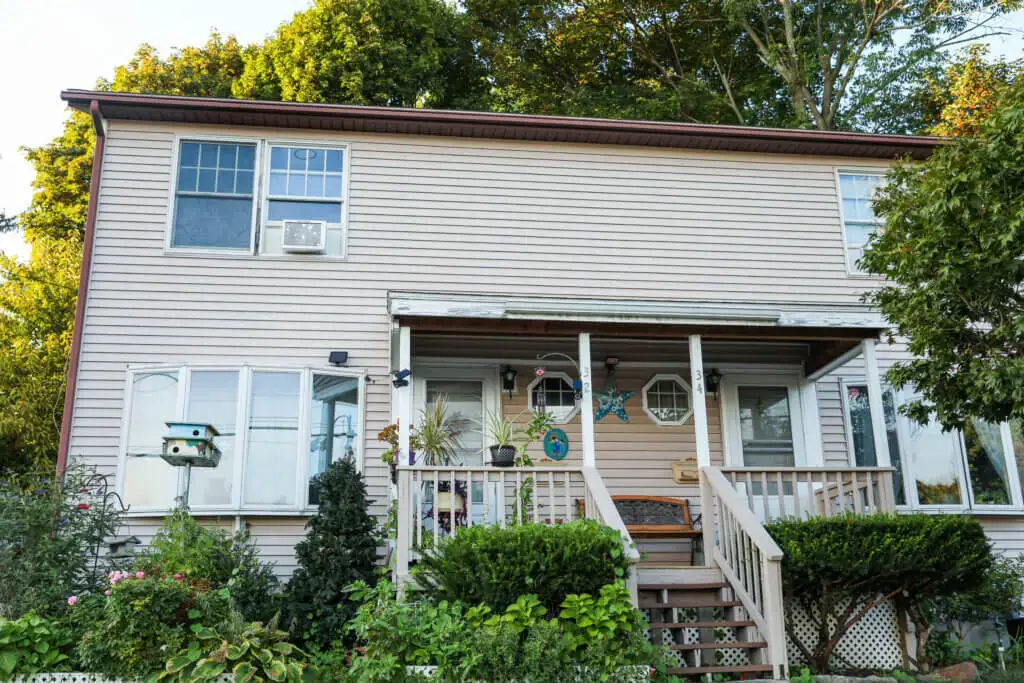 A house with a porch and stairs