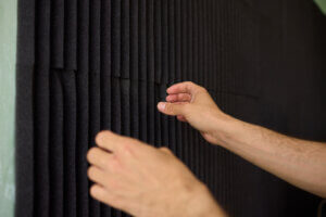 How do you soundproof a wall